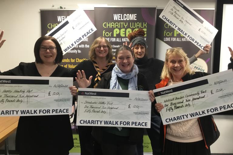 Charities picked up cheques following the fundraising Charity Walk for Peace
